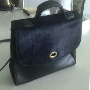 Anthropologie black handbag with faux navy fur
